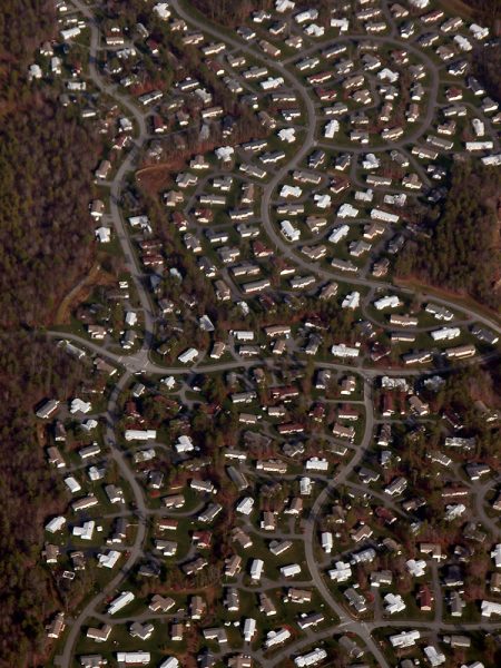 Image shows an aerial  view of a suburban community.